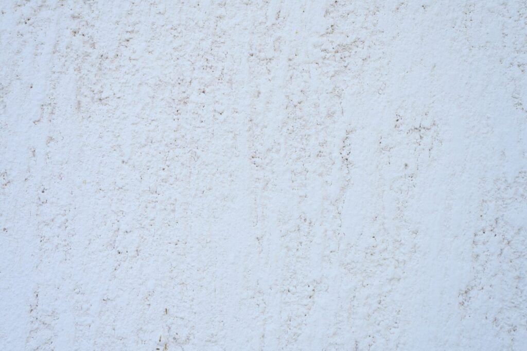 Rough texture of abstract decorative white background of plaster wall